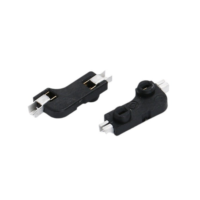 Switchwell – Pair of black hot-swap sockets, one flipped to show the metal clips and one showing the top with openings