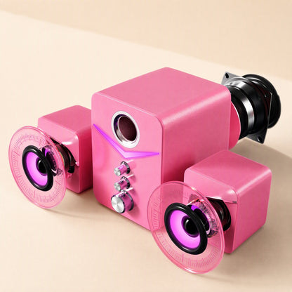 Soundbud – Pink speaker trio with clear disc covers lifted off the satellites to reveal the purple-lit drivers