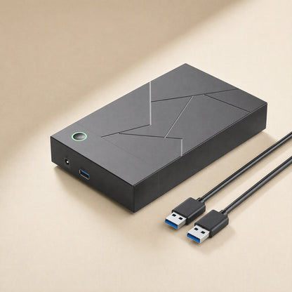 Diskbox 3.5-Inch USB Hard Disk Box in black with glowing power button, power port, USB port and two USB cables
