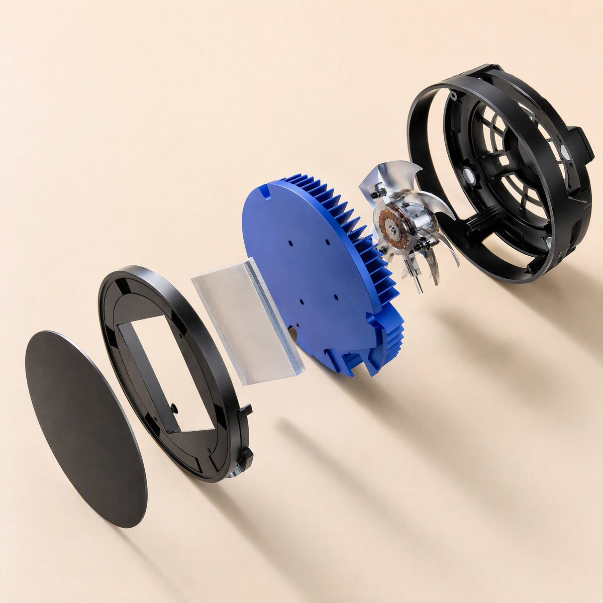 Chipfrost – Exploded view of the radiator showing its magnetic plate, blue heatsink, cooling chip and fan housing
