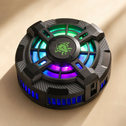 Chipfrost – Phone cooling clip at an angle with green, blue and purple lights and blue side vents on a beige surface