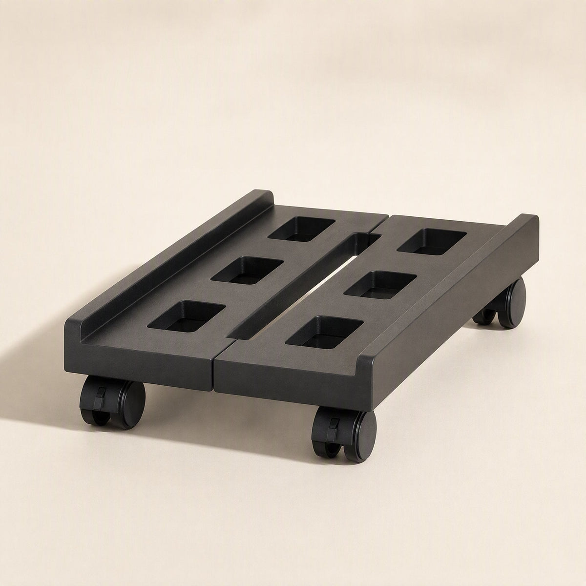 Towerroll Retractable Computer Host Rack – black rack with wheeled base and rectangular cutouts, shown from a low front angle