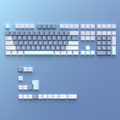 Cloudira – Full keycap set laid flat on a blue background, showing alphanumeric, function and arrow keys with extras below