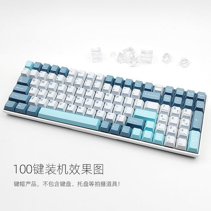 Cloudira – Keycap set installed on a 100-key keyboard with ice cubes beside it, in blue, aqua and white colorway