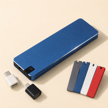 Bytecarry Portable Metal SSD in blue with two USB adapters and four colored cover plates beside it