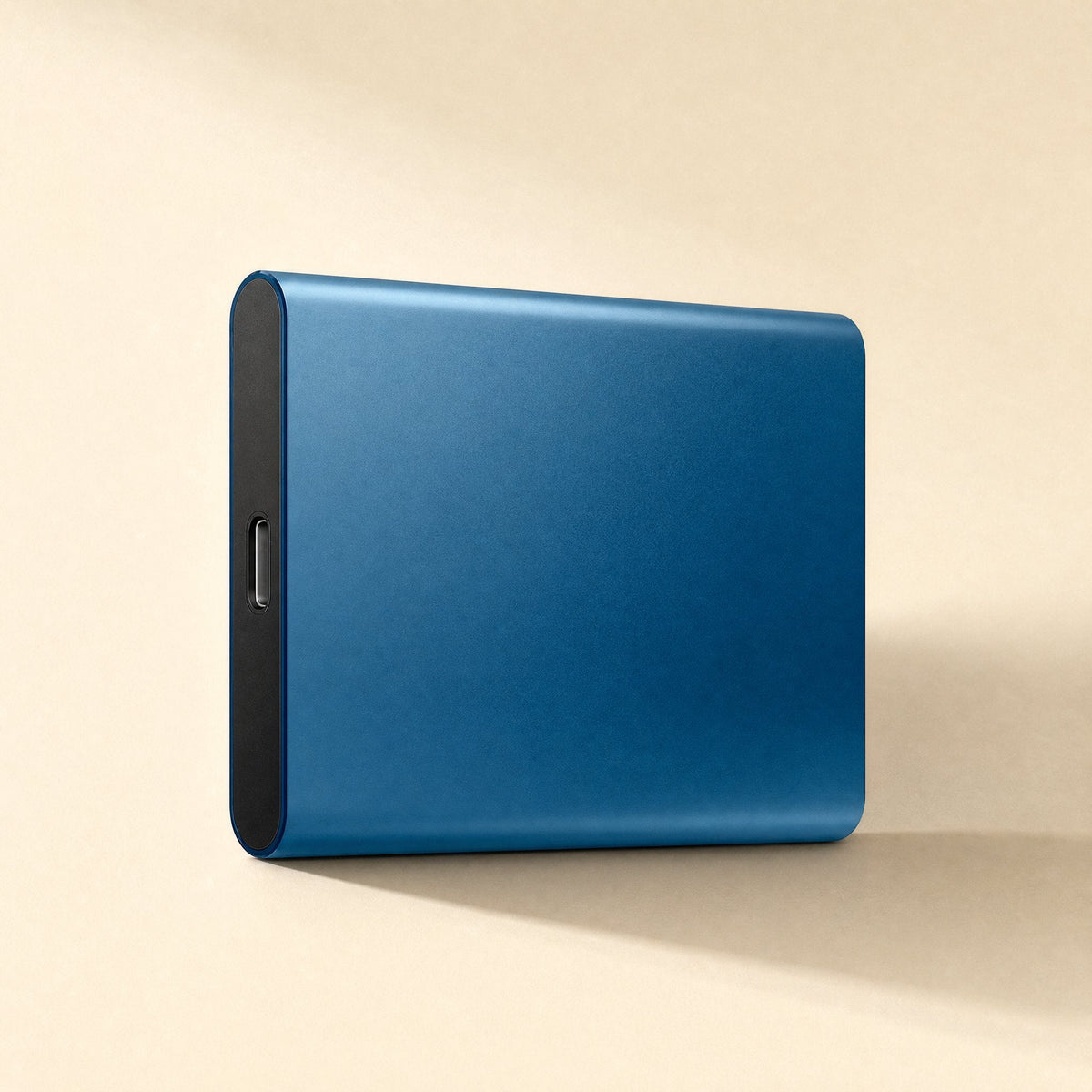 Shellswift – Blue metal portable drive standing upright, showing the USB-C port on its black end panel