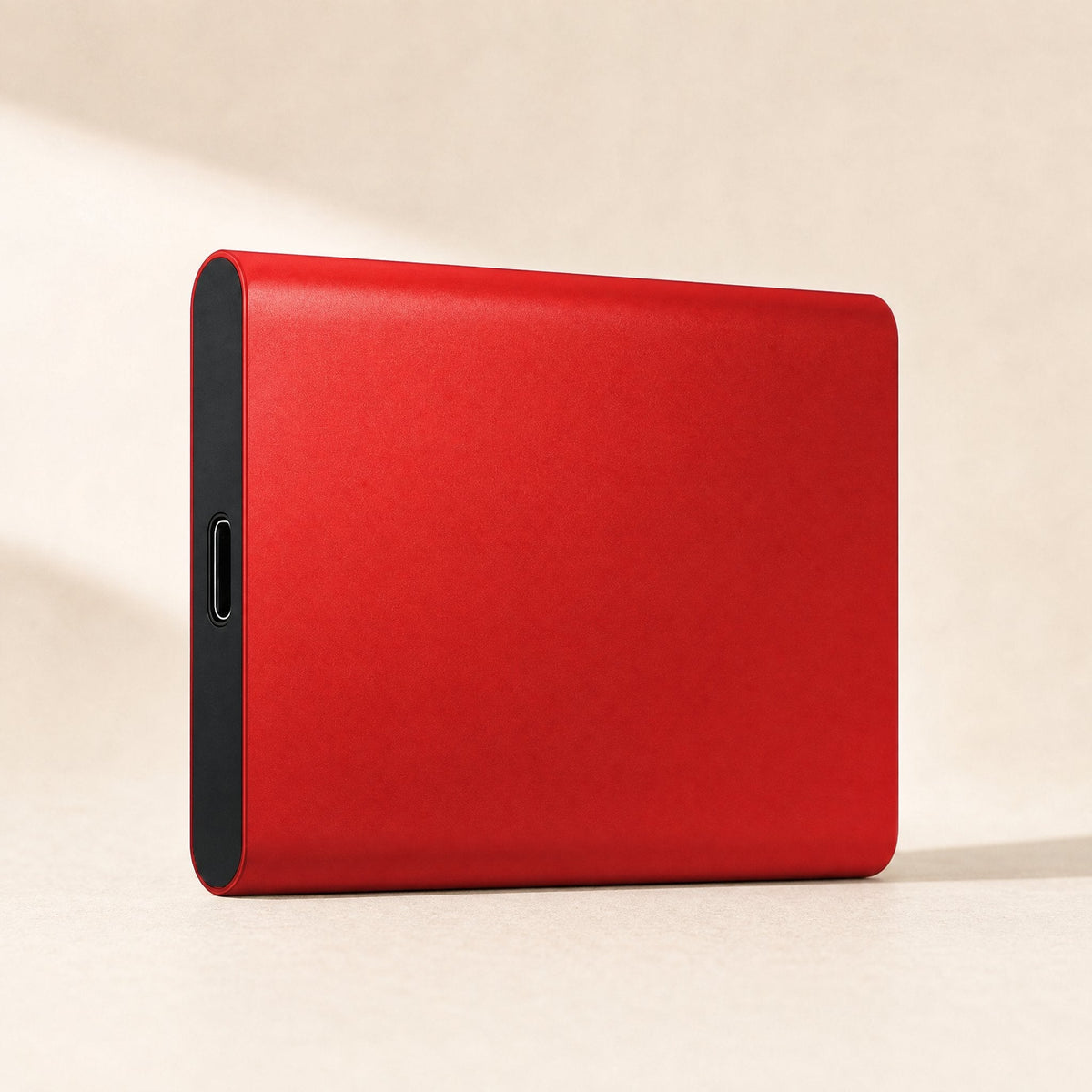 Shellswift – Red metal portable drive standing on its edge, with the USB-C port visible on the black end