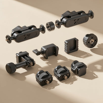 Armanchor – Magic arm mount components, two arms, phone clamps and cold-shoe adapters, scattered in sunlight