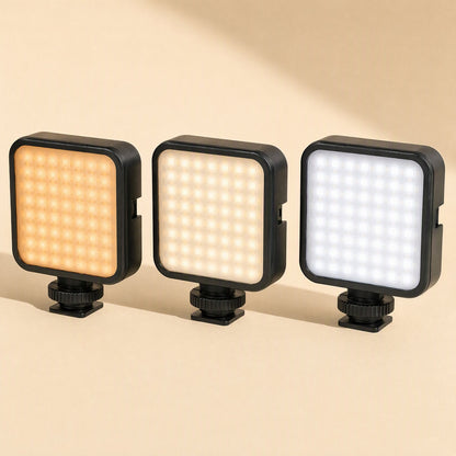 Faceglow – Three compact square LED panels on mounts glowing warm orange, soft white and cool white side by side