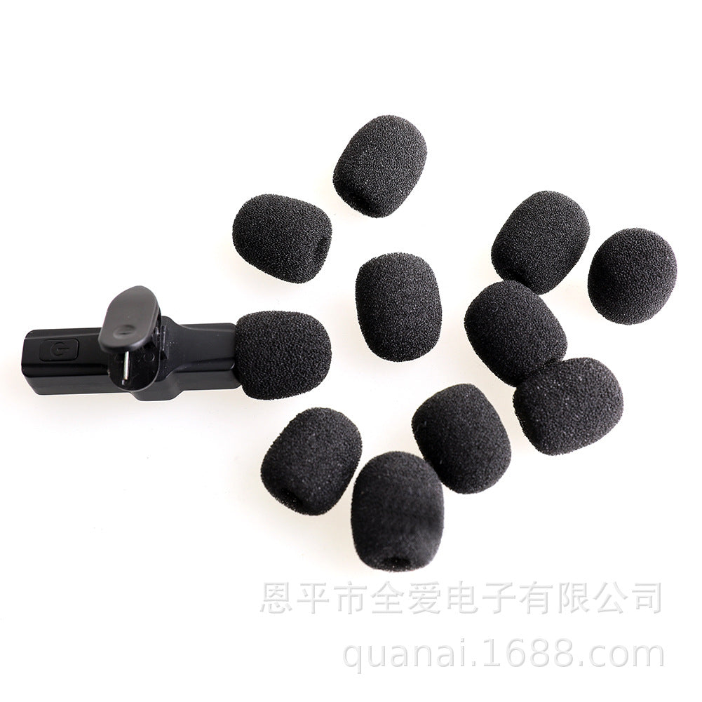 Windsponge – Ten black foam mic covers scattered around a small clip-on microphone on a white background