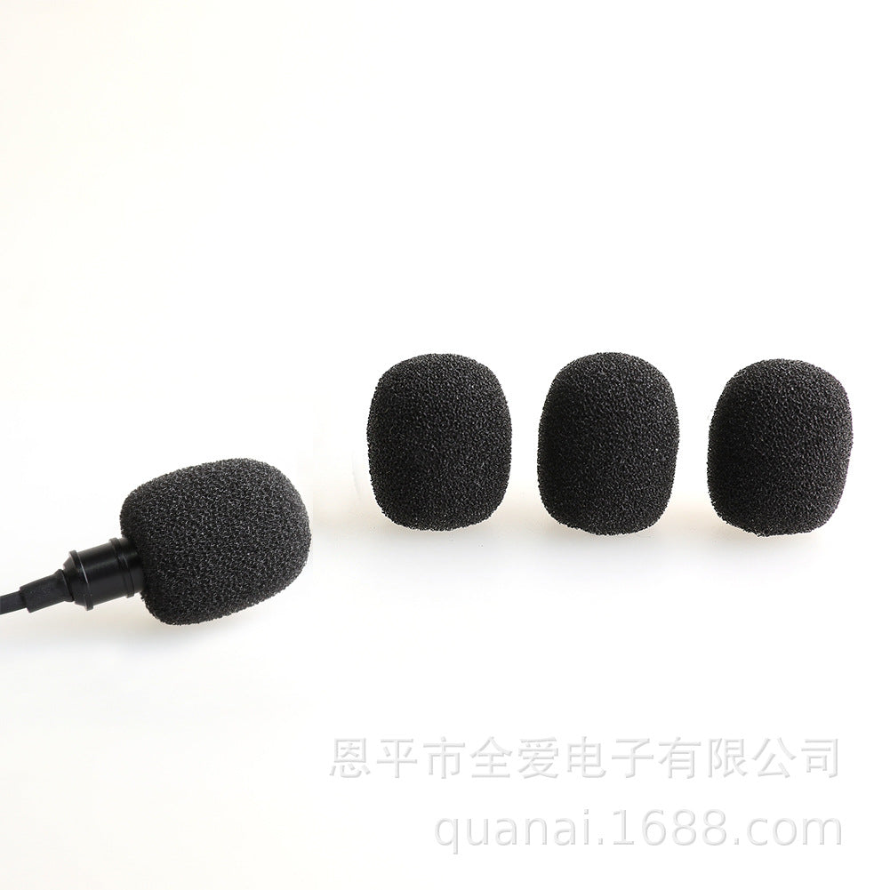 Windsponge – Black foam mic cover fitted on a lavalier microphone beside three loose covers on white