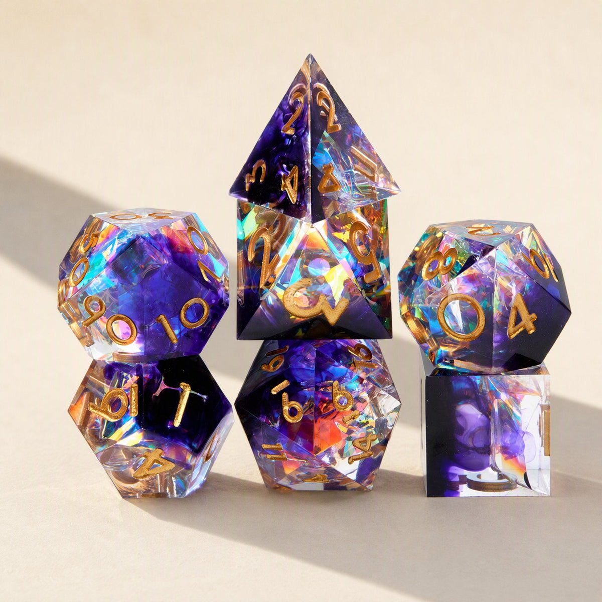 Fateforge – Purple and clear resin dice with gold numbers and rainbow prismatic glints, stacked in a standing display