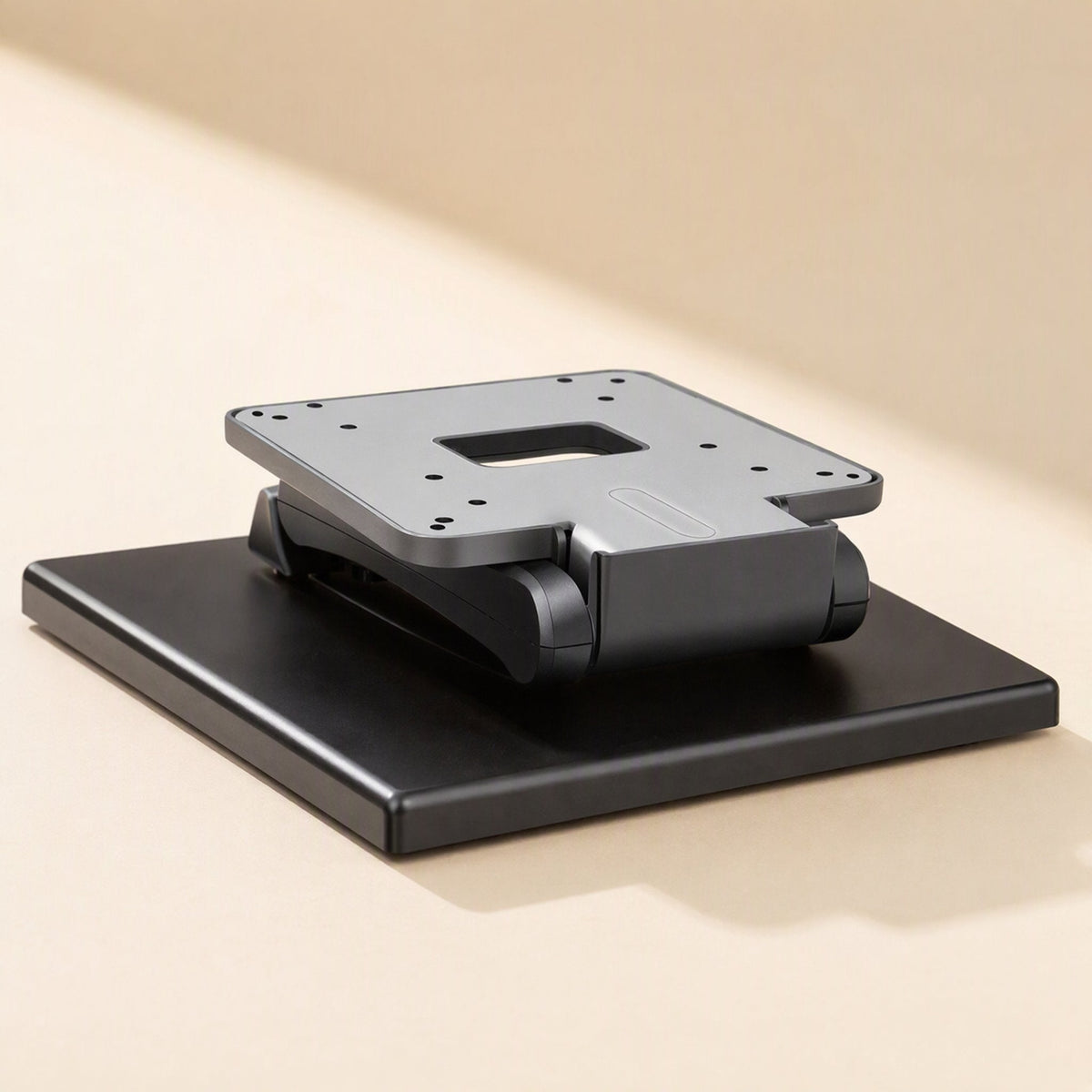 Viewtilt Folding Monitor Stand – stand folded flat with the grey VESA mounting plate resting over the black base