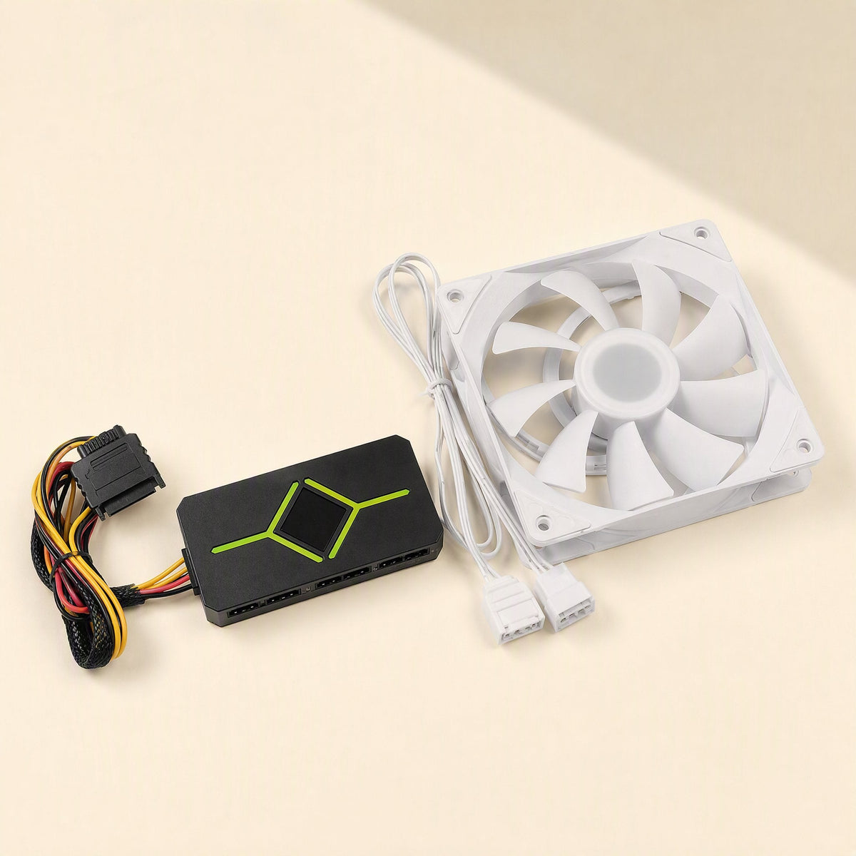 Prismchill – White fan with braided cables beside a black hub controller with a SATA power connector