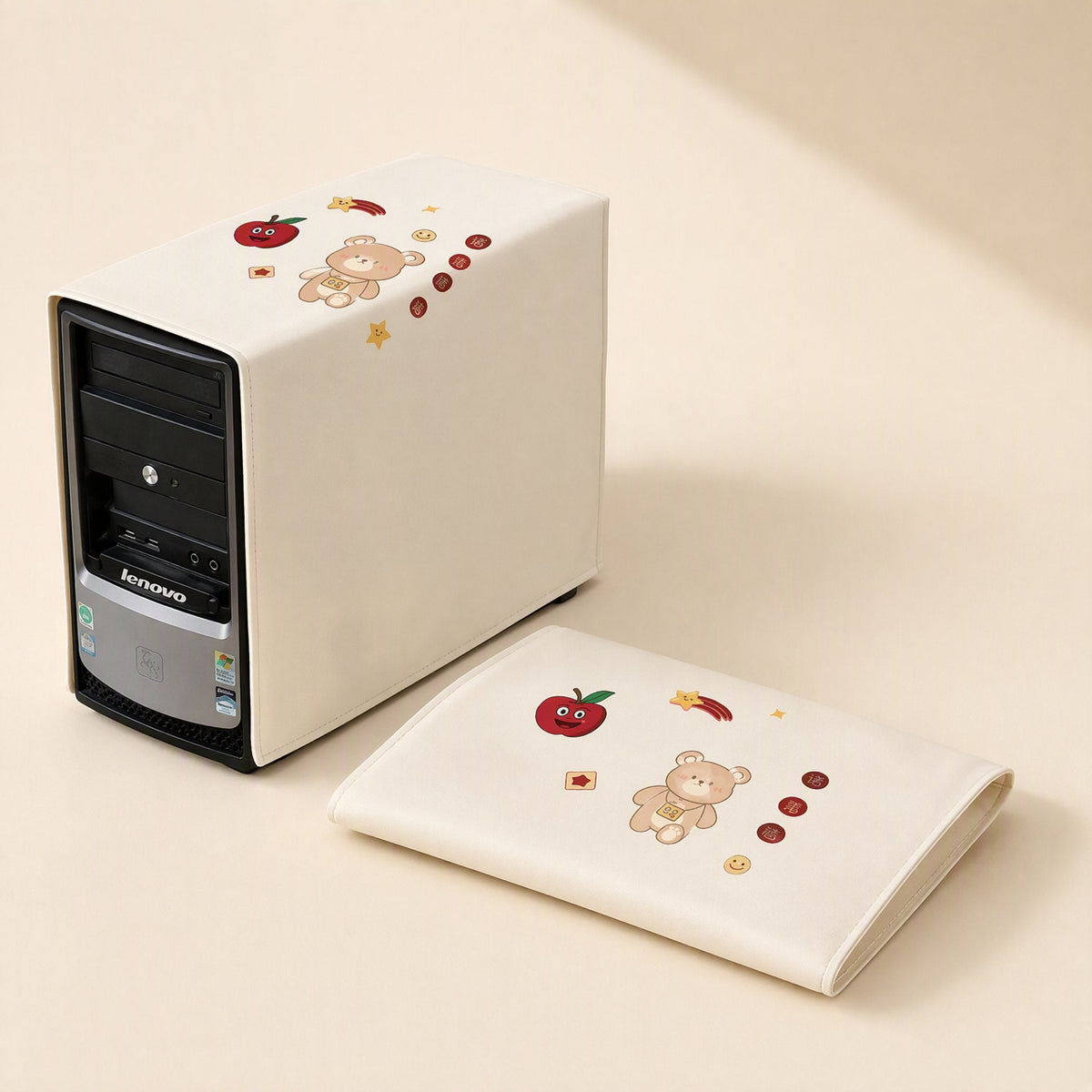 Dustcloak – Cream computer dust cover with a teddy bear and red apple print on a tower case, folded keyboard cover in front
