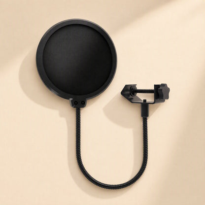 Meshhush – Front view of the black round mesh screen with gooseneck stem and clamp, shown flat on a beige surface