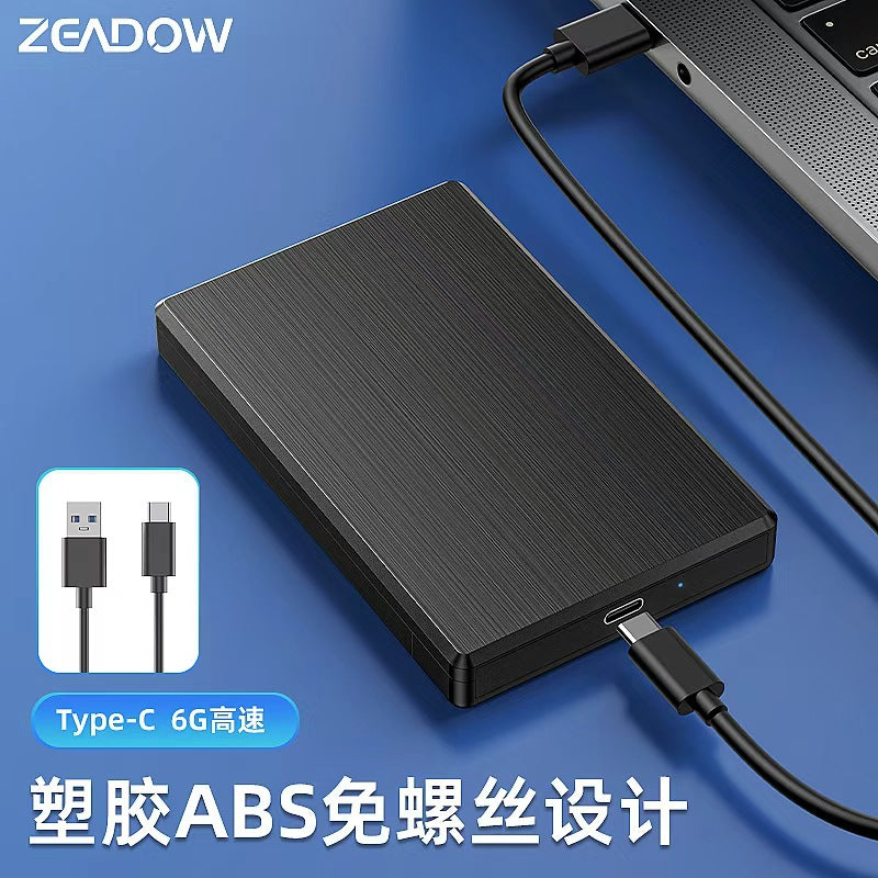 Shellink 2.5-Inch Hard Drive Enclosure in black connected to a laptop by a USB-C cable, with a cable inset