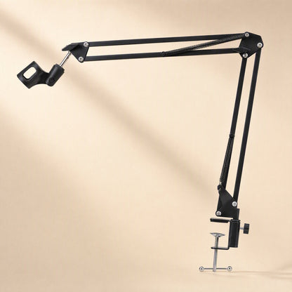 Voicebrace – Extended black boom arm with empty microphone clip and screw clamp, shown against a soft beige backdrop