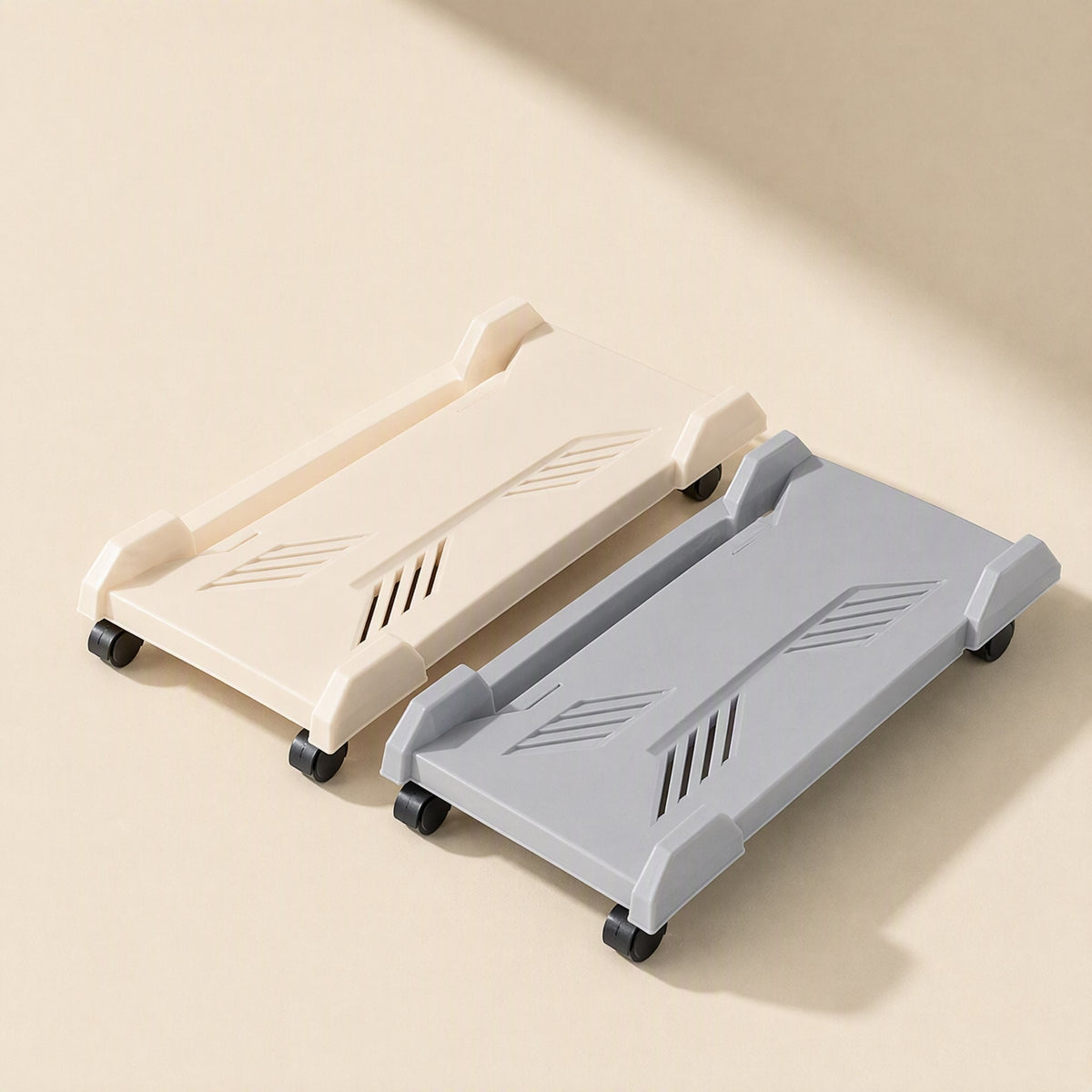 Deskroll Plastic Desktop Computer Stand With Wheels in cream and grey, seen from above on a beige surface