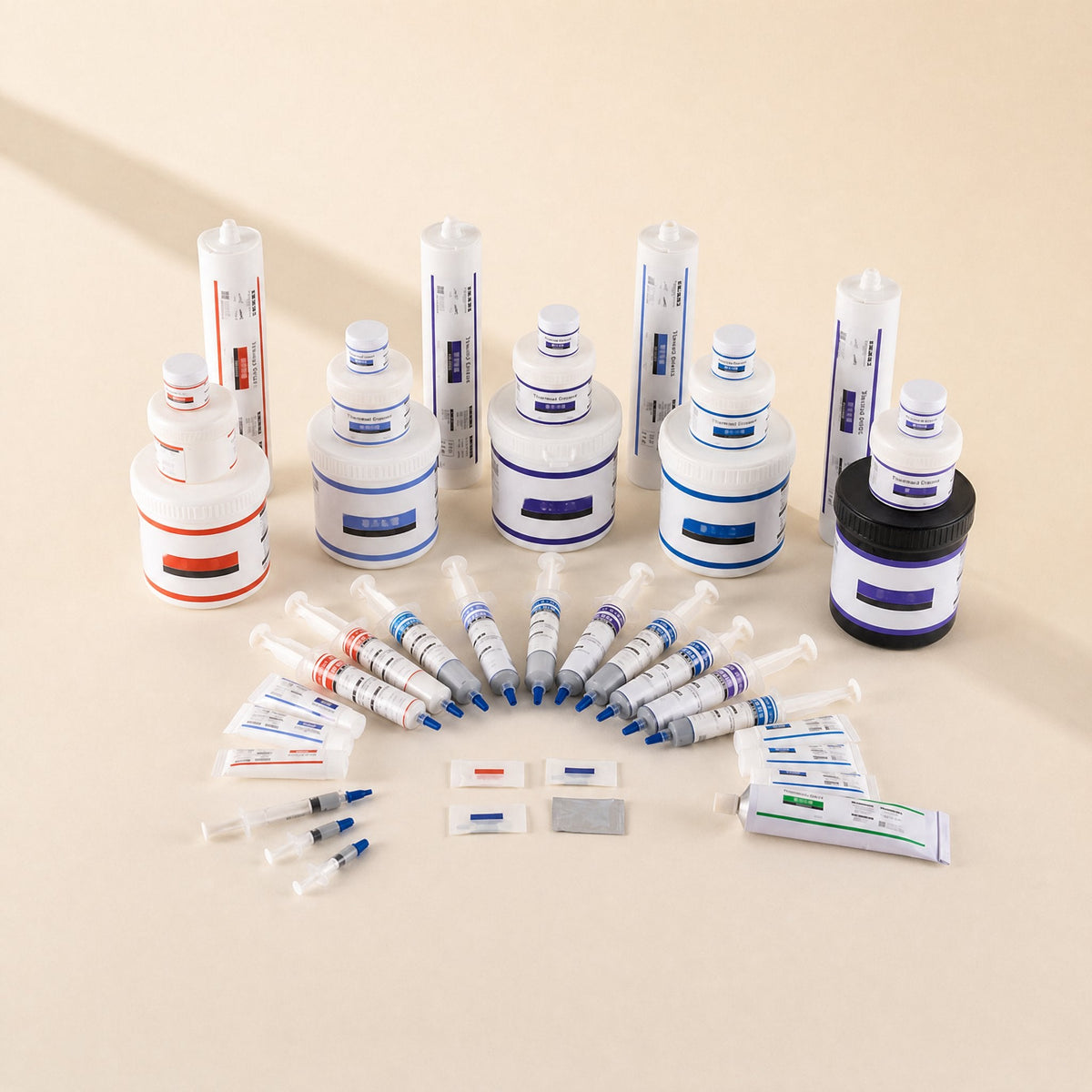 Silkspread – Full range of thermal paste jars, cartridges, syringes, tubes and sample packs laid out together