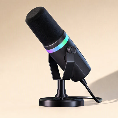 Glowvoice – Black cardioid mic tilted on its desk stand, three-quarter view with cyan and purple light ring and attached