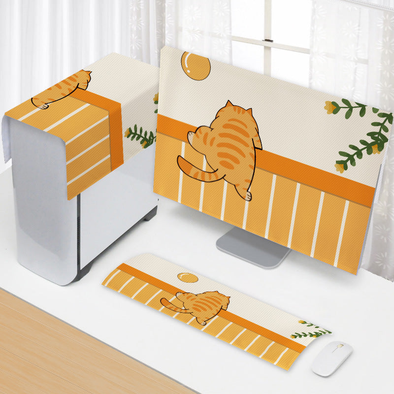 Doodleveil Cartoon Computer Cover set in orange with a cat on monitor, tower and keyboard covers on a white desk