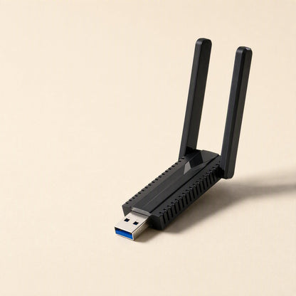 Bandreach – Side view of the black dual-antenna USB adapter, ventilation slots along the body and USB 3.0 plug extended