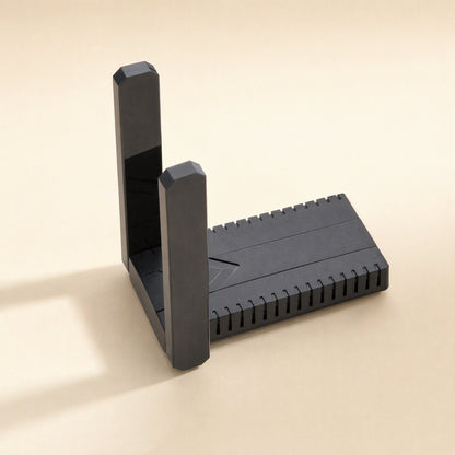 Bandreach – Close-up of the adapter's ridged casing with both antennas folded flat against the body on a cream background