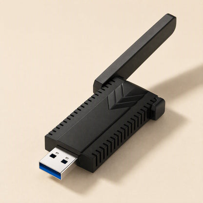 Bandreach – Top-angle view of the black USB adapter with one antenna tilted up and the blue USB connector in front