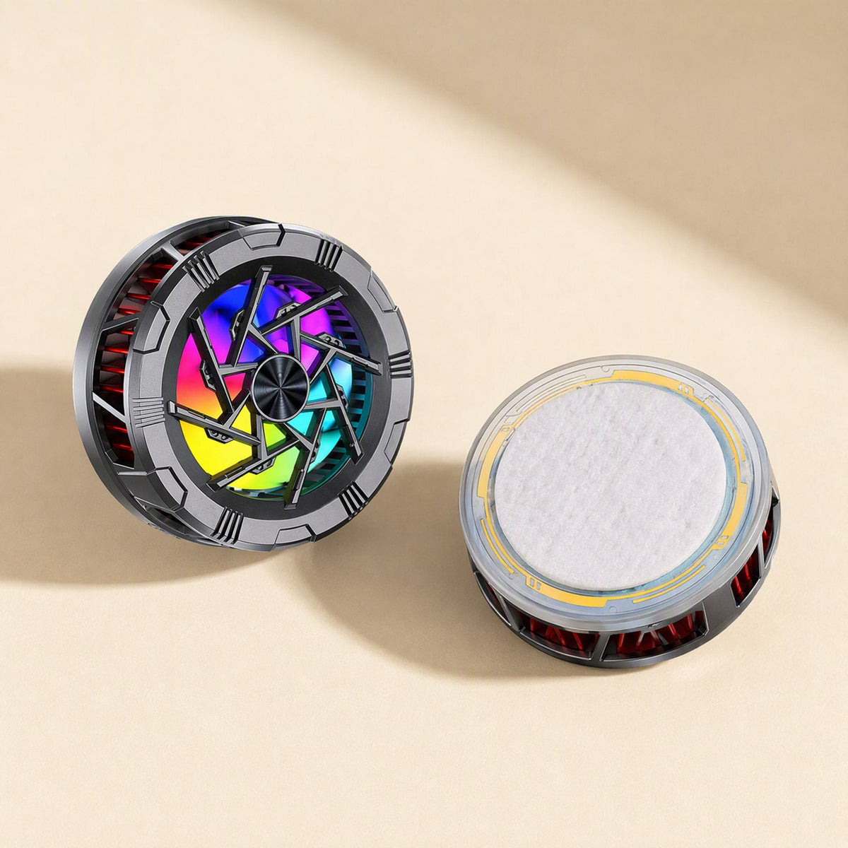 Chillback – Pair of radiators, one with a rainbow-lit fan and one with a white pad inside a clear rim with gold trim