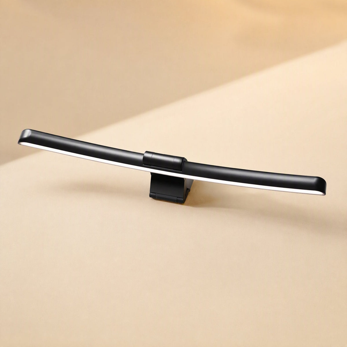 Metalshade Metal Monitor Hanging Lamp, a curved black light bar with clip, shown at a slight angle