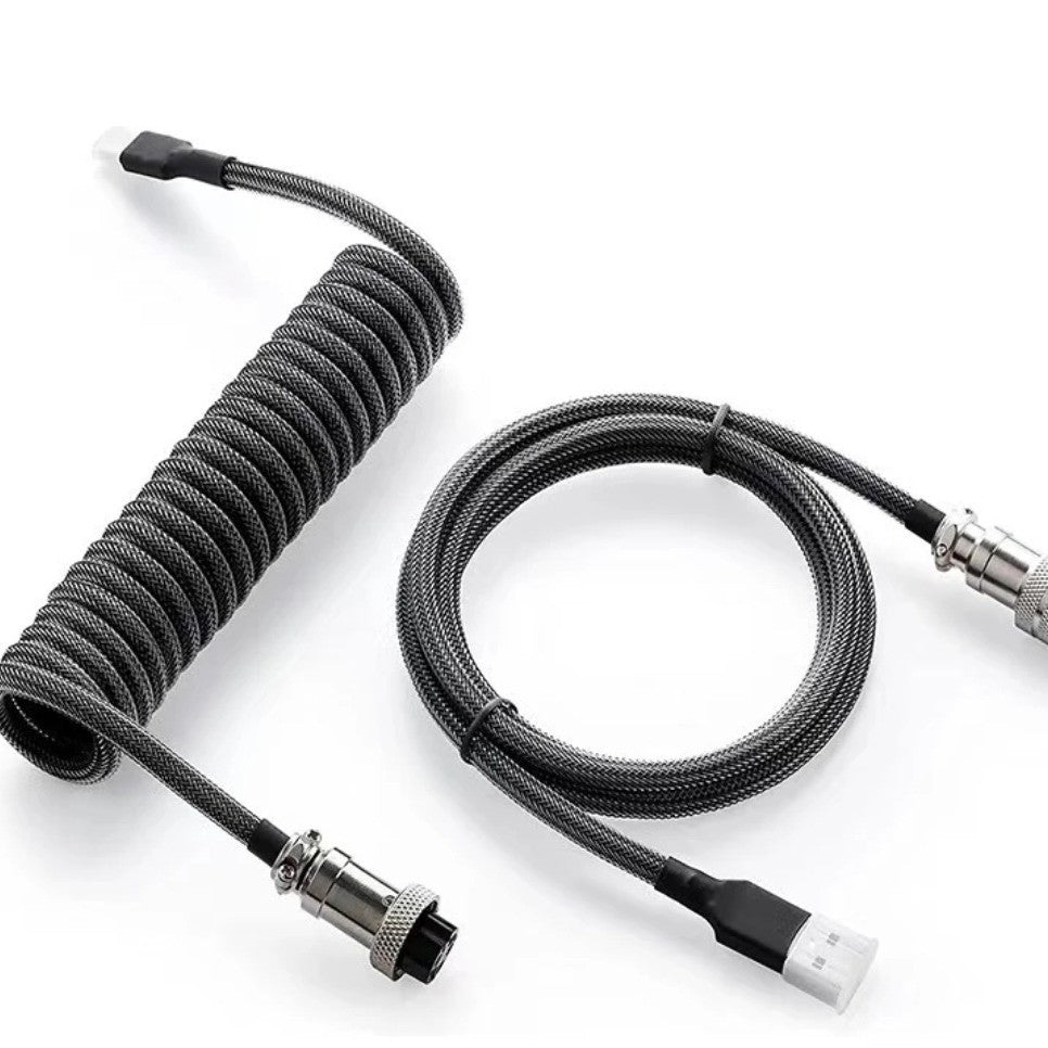 Coilaire – Black and grey braided coiled keyboard cable with aviator connector, coil beside a looped straight section