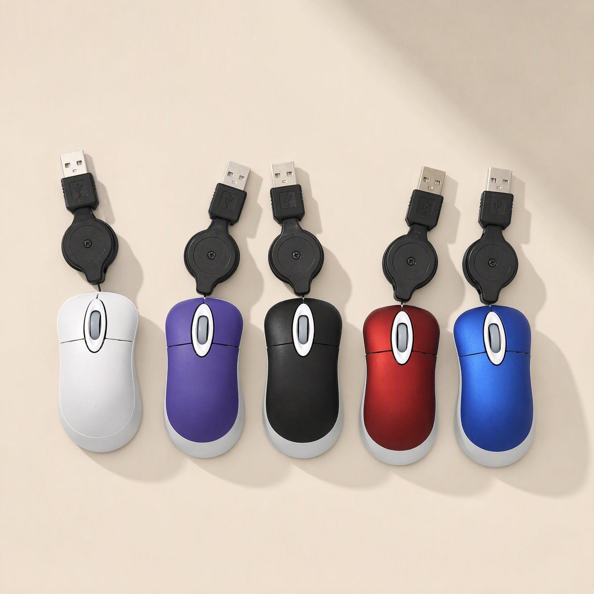 Miniclick – Row of five mini mice in white, purple, black, red and blue with coiled USB cords extended upward