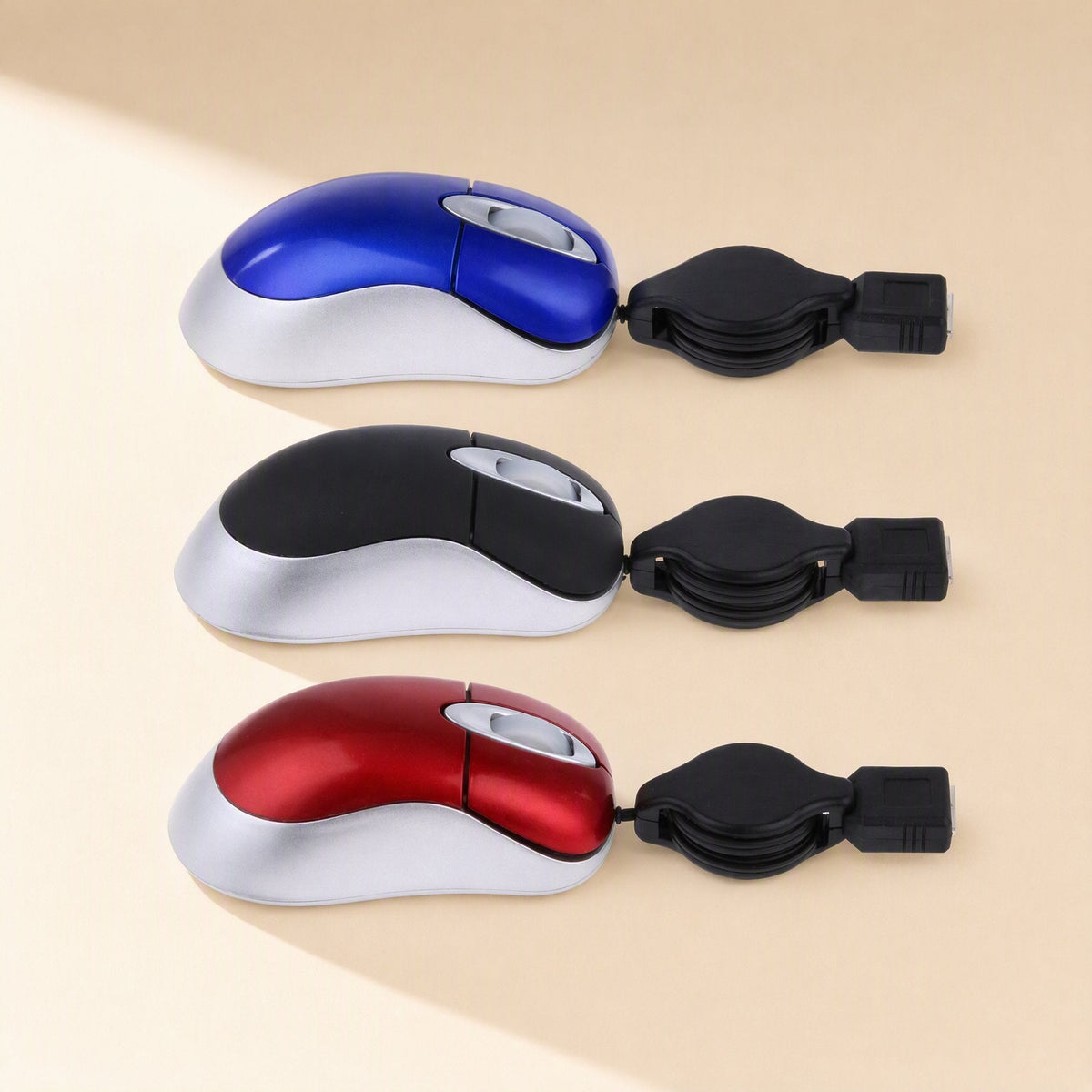 Miniclick Mini Wired USB Mouse – side view of blue, black and red mini mice with silver bases and retractable USB cable reels