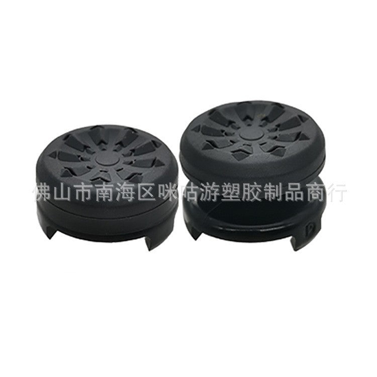 Griprise – Pair of black joystick caps with a raised radial top pattern, one low profile and one tall, on white