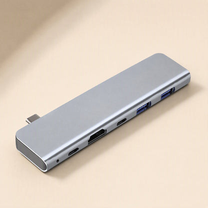 Portpocket 5-in-1 USB 3.1 docking station in space gray, angled view showing HDMI, USB-C and two USB-A ports