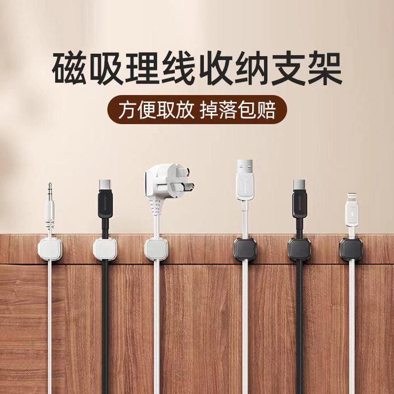 Weftloop – Row of six magnetic cable clamps in white and black holding audio, USB-C, plug and Lightning cables