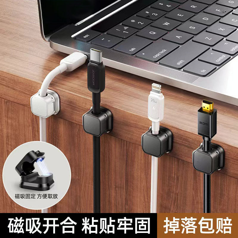Weftloop – White and black clamps under a laptop on a wooden desk holding USB-C, Lightning and HDMI cables
