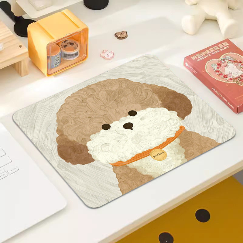 Pupmat Cartoon Puppy Mouse Pad with a brown poodle in an orange collar on a desk beside a laptop