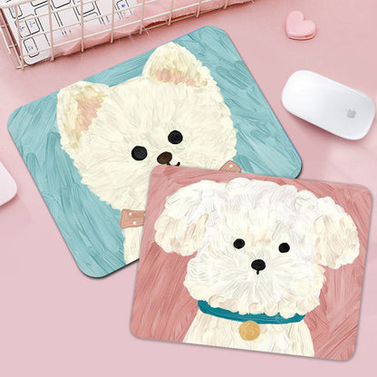 Pupmat – Two painted puppy mouse pads, one white dog on teal and one on pink, next to a white computer mouse