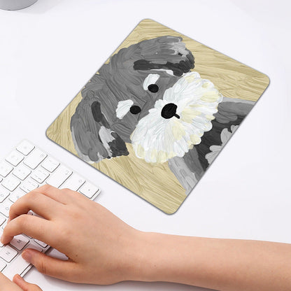 Pupmat – Square mouse pad with a gray schnauzer on a yellow background, a hand typing on a white keyboard nearby