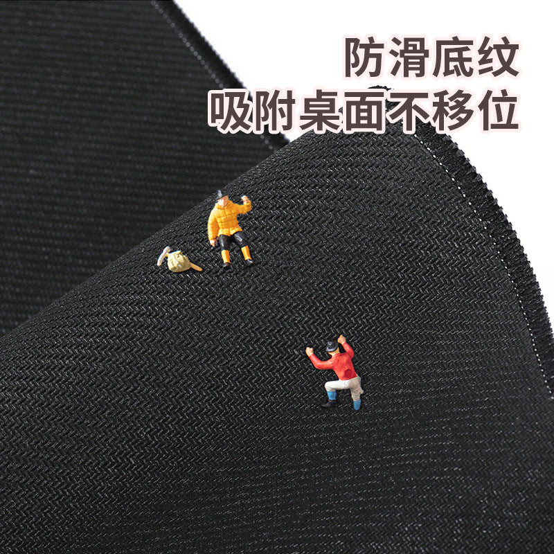 Pupmat Cartoon Puppy Mouse Pad – close-up of the black textured non-slip underside with tiny figurines standing on the fabric