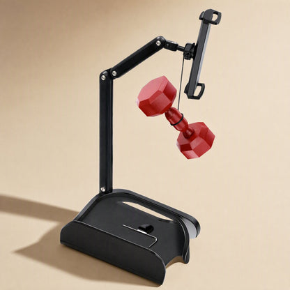 Carbonprop – Folding black stand with a tablet clamp on an extended arm and a red dumbbell hanging below it