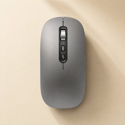 Voiceclick Wireless Bluetooth Voice Typing Mouse in gray, top-down view on a cream background