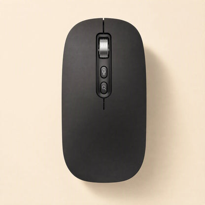 Voiceclick – Matte black version of the mouse, top-down, with silver scroll wheel and two buttons on a cream background