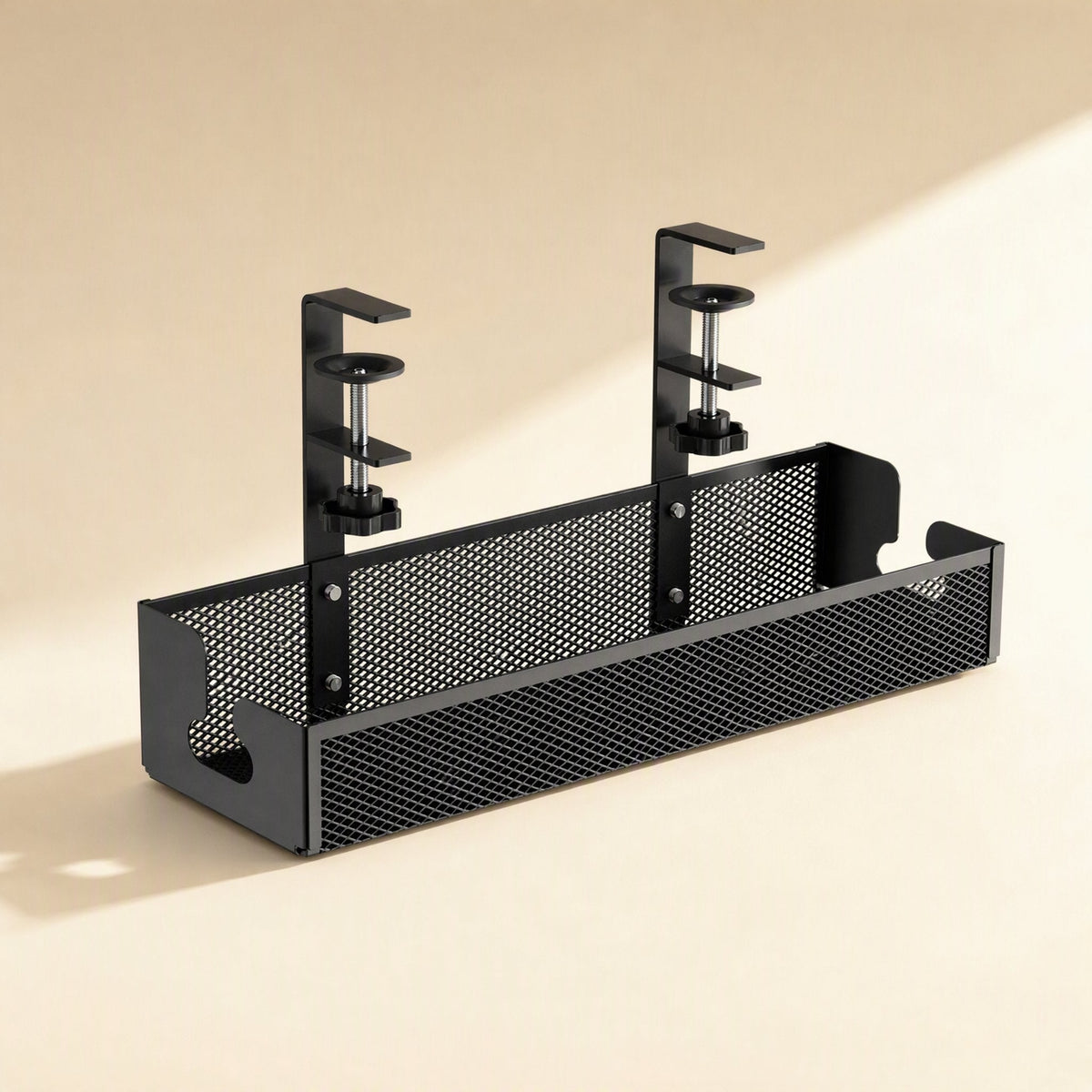 Desktrack – Rear angled view of the black mesh cable organizer with riveted clamp brackets and open cable slots