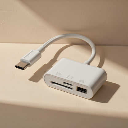 Portbyte Type-C SD/TF card reader in white with a curved cable, shown from above on a cream surface