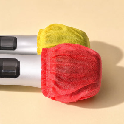 Freshveil Disposable Non-Woven Microphone Cover – red and yellow covers fitted over the heads of two silver microphones