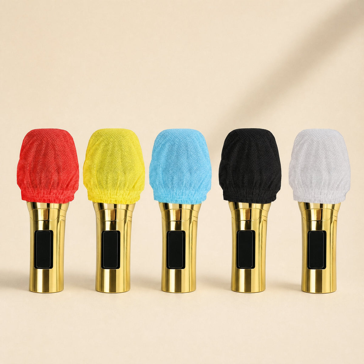 Freshveil – Five gold microphones side by side, each wearing a cover in red, yellow, blue, black or white