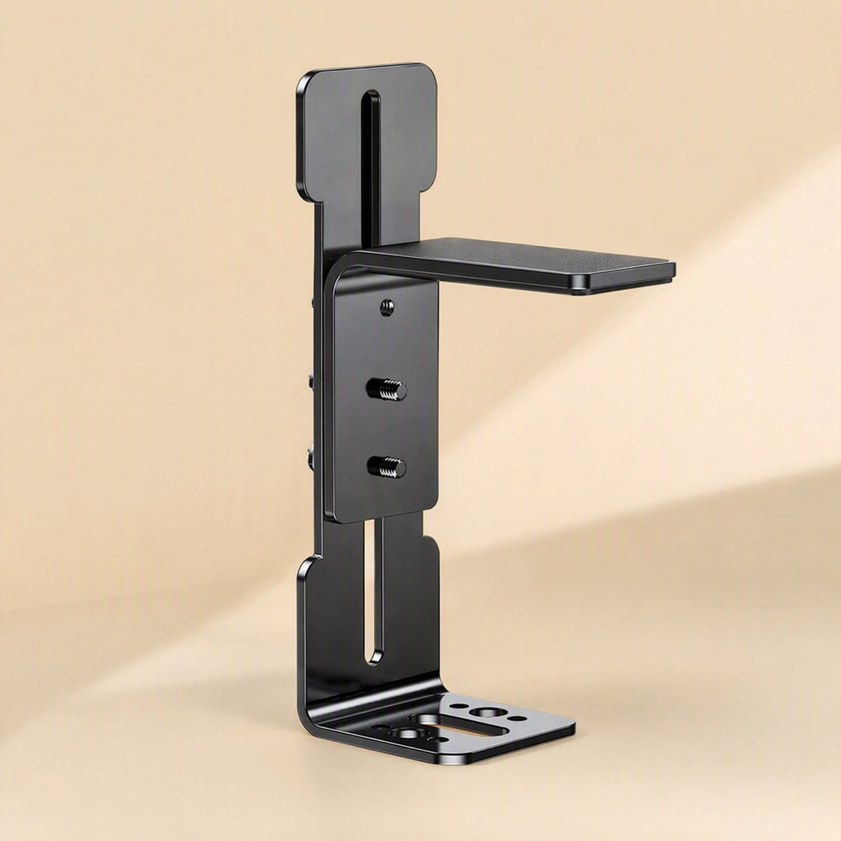 Cornerhold – Rear view of the black L-shaped bracket with threaded studs, long slot and mounting holes on the base plate